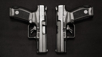 Two identical black pistols side-by-side.