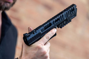 Holding the Canik Rival with Compensator attached
